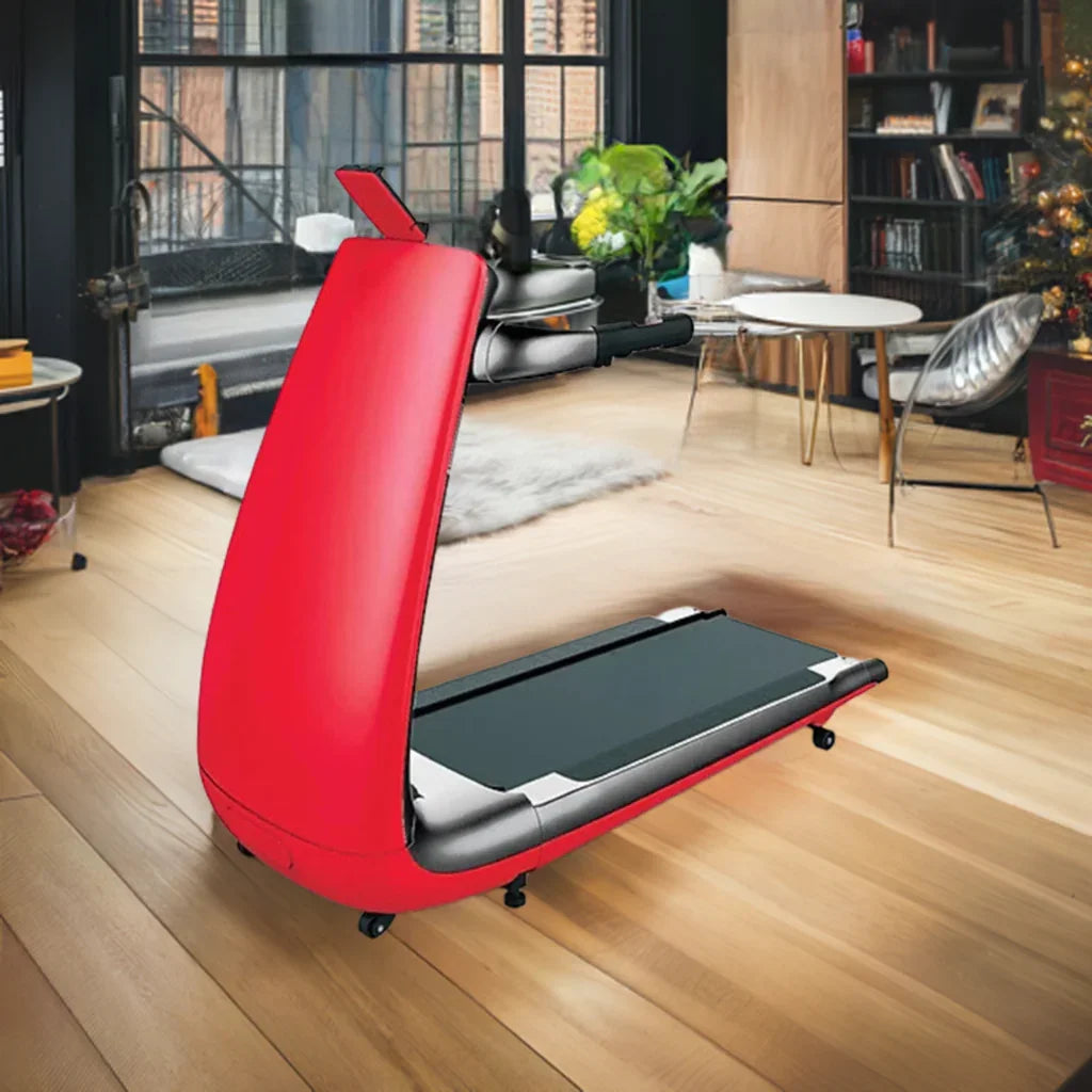 Red foldable treadmill in modern home gym with large windows and wooden floors